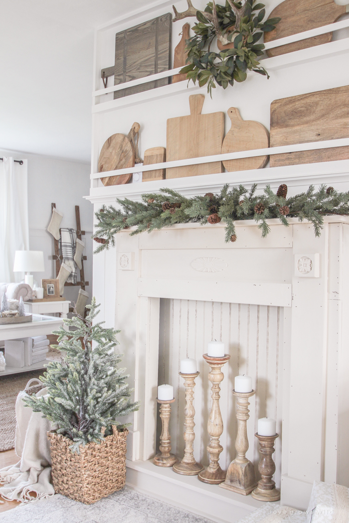 A rustic mantel is given a big makeover for the holidays! See how milk paint transformed this cozy cottage mantel.