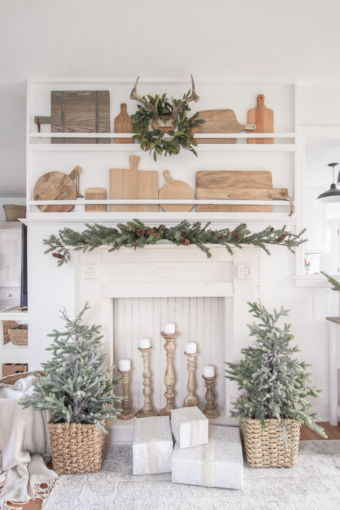 A rustic mantel is given a big makeover for the holidays! See how milk paint transformed this cozy cottage mantel.