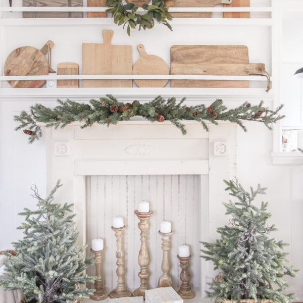 A rustic mantel is given a big makeover for the holidays! See how milk paint transformed this cozy cottage mantel.