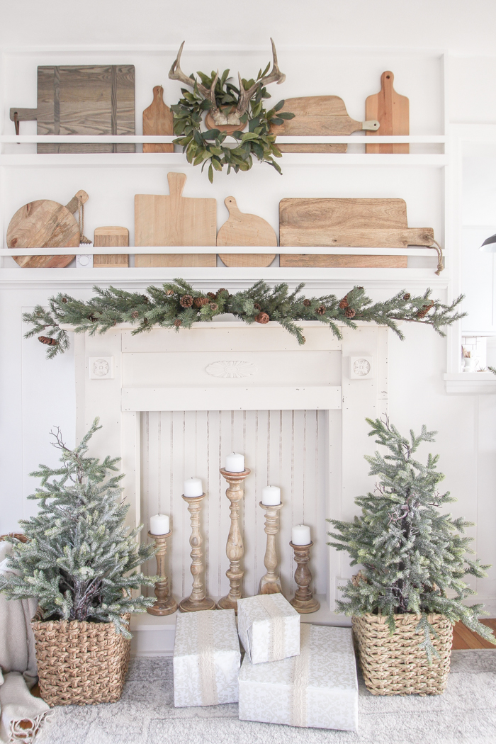 A rustic mantel is given a big makeover for the holidays! See how milk paint transformed this cozy cottage mantel.