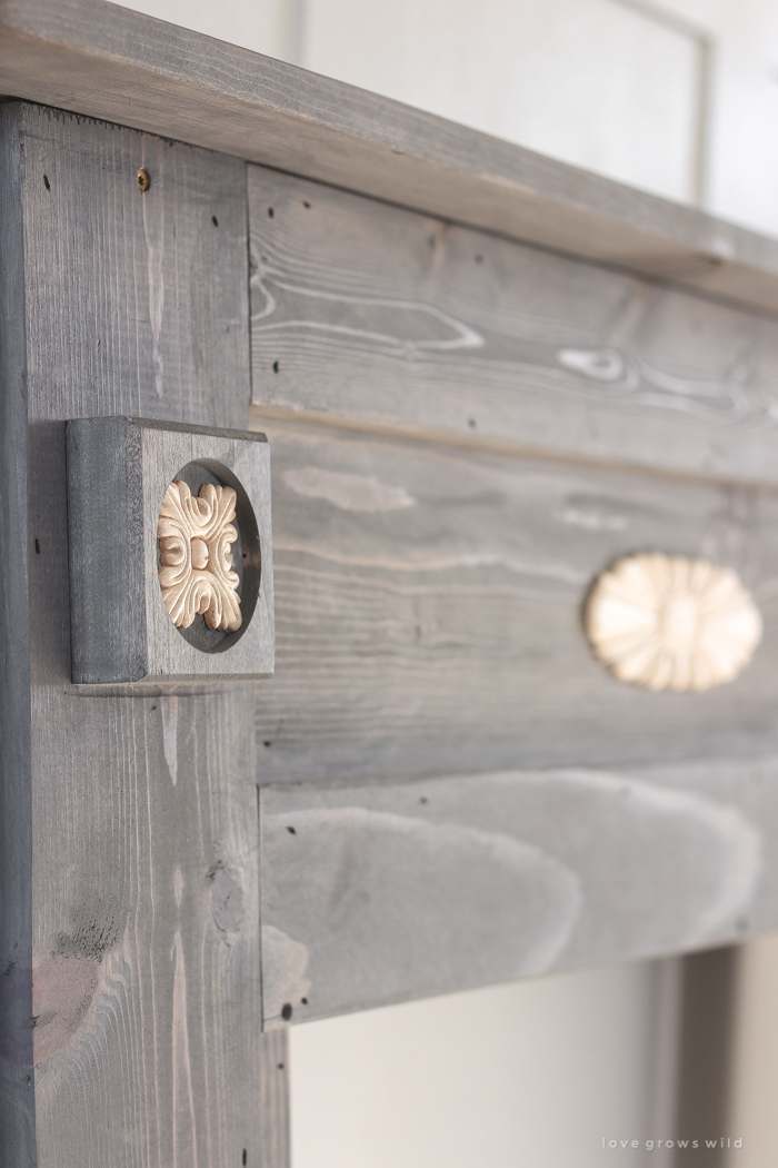 A rustic mantel is given a big makeover for the holidays! See how milk paint transformed this cozy cottage mantel.