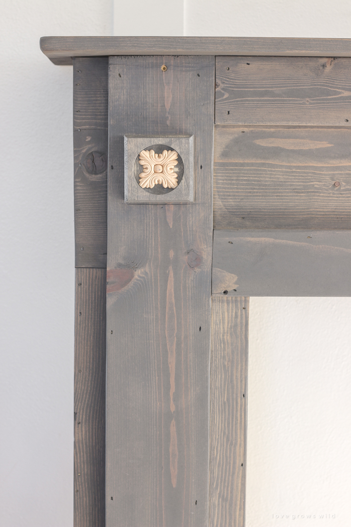 A rustic mantel is given a big makeover for the holidays! See how milk paint transformed this cozy cottage mantel.