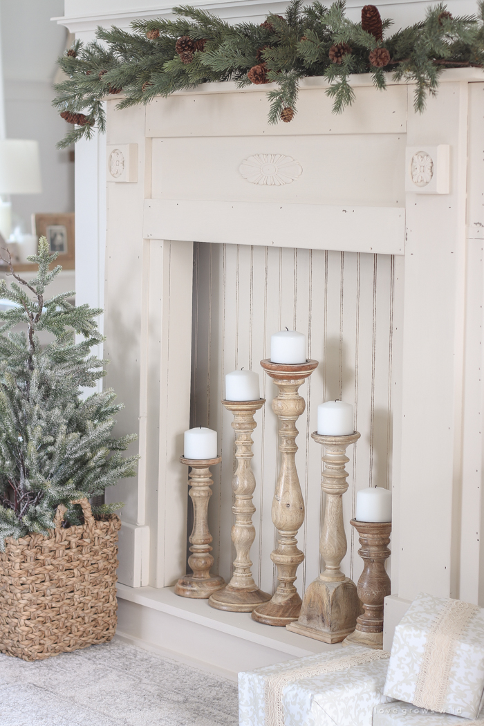 A rustic mantel is given a big makeover for the holidays! See how milk paint transformed this cozy cottage mantel.