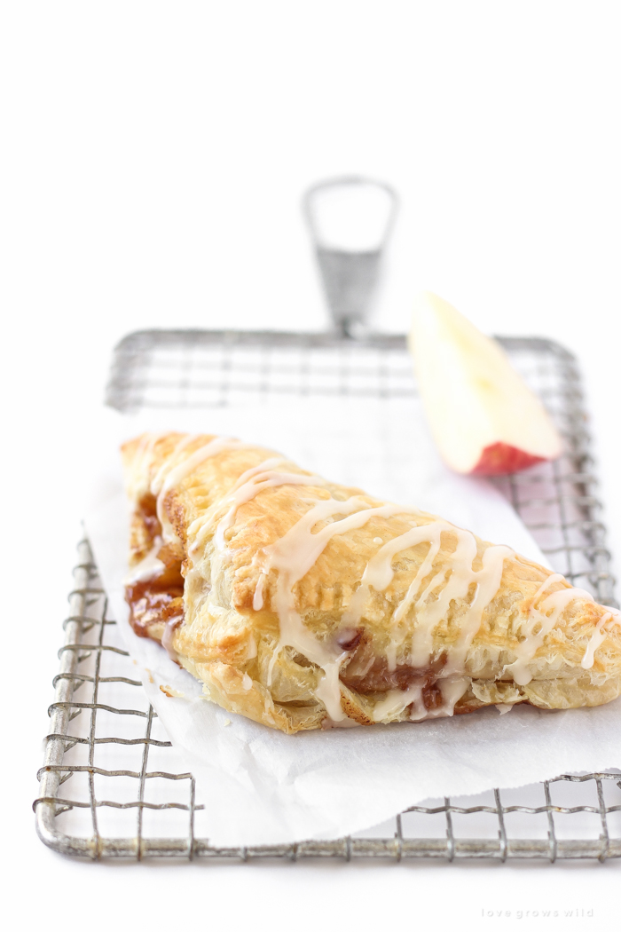 Delicious apple turnovers with a flaky pastry crust, apple cinnamon filling, and sweet vanilla glaze