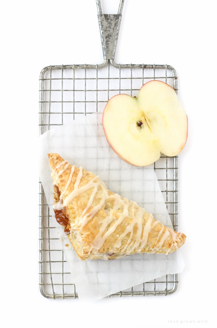 Delicious apple turnovers with a flaky pastry crust, apple cinnamon filling, and sweet vanilla glaze