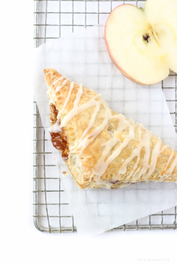 Delicious apple turnovers with a flaky pastry crust, apple cinnamon filling, and sweet vanilla glaze