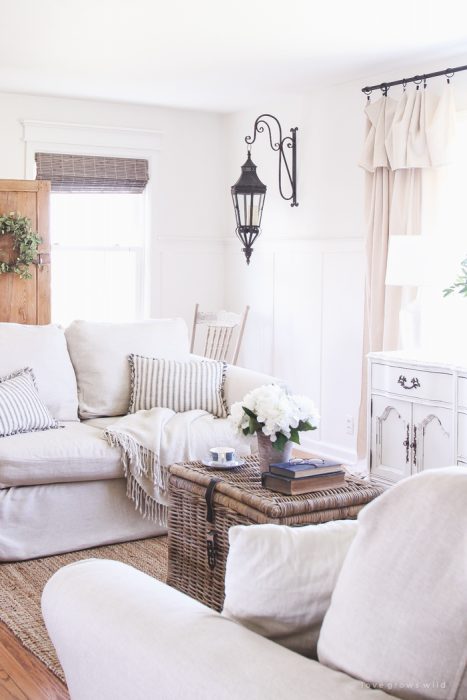 See how this small farmhouse living room transformed and evolved over the years from dark and dated to light, bright and beautiful!