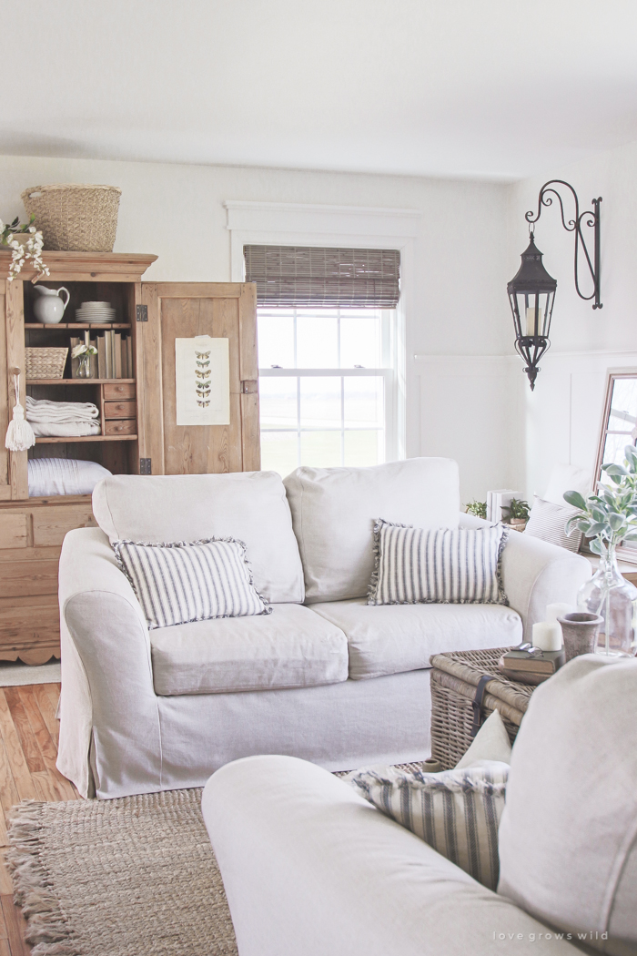 See how this small farmhouse living room transformed and evolved over the years from dark and dated to light, bright and beautiful! 