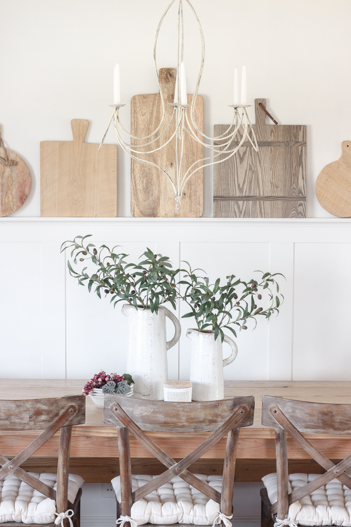 This dining room shares space with a living room, but maximizes style and looks stunningly fresh.