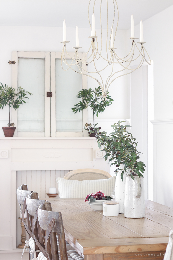 This dining room shares space with a living room, but maximizes style and looks stunningly fresh.