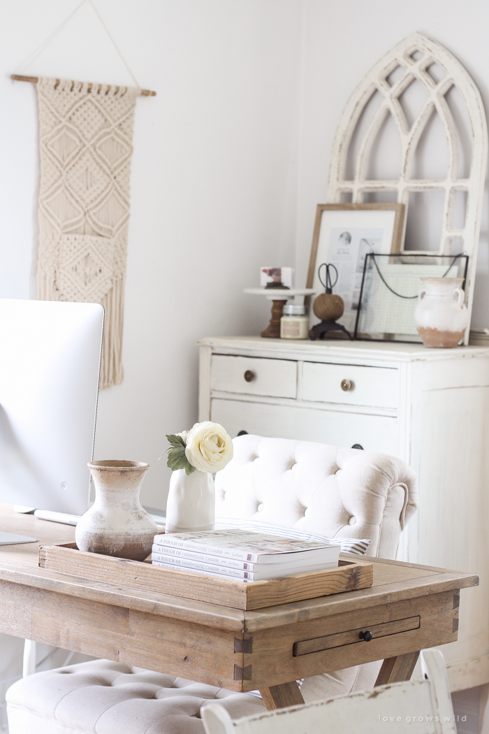 A lovely casual home office with lots of light, soft textures, and gorgeous greenery. 