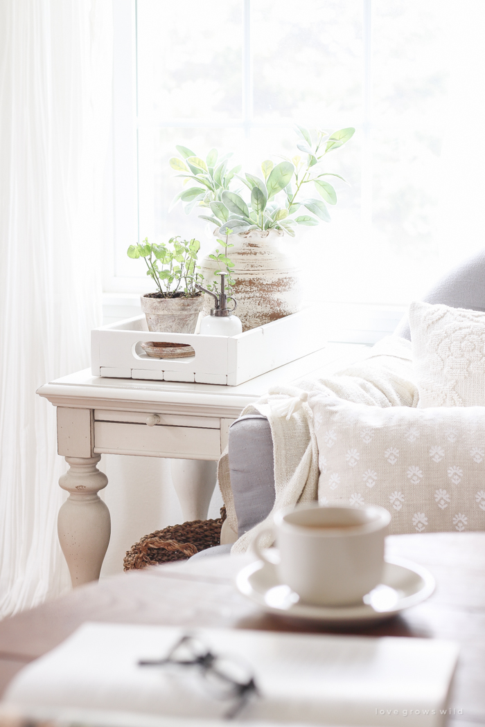 A lovely casual home office with lots of light, soft textures, and gorgeous greenery. 