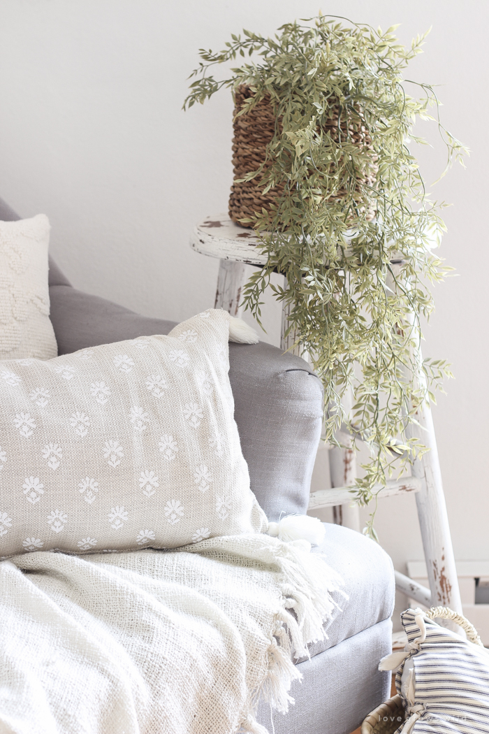 A lovely casual home office with lots of light, soft textures, and gorgeous greenery. 