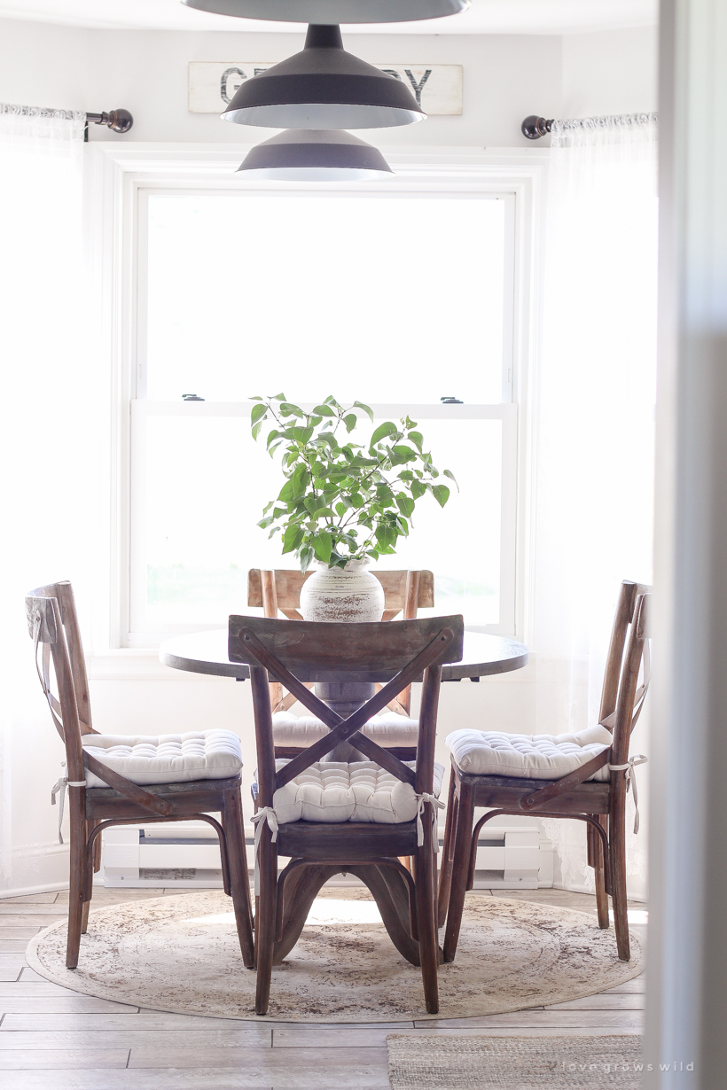 A cozy farmhouse kitchen decorated simply with elements from nature