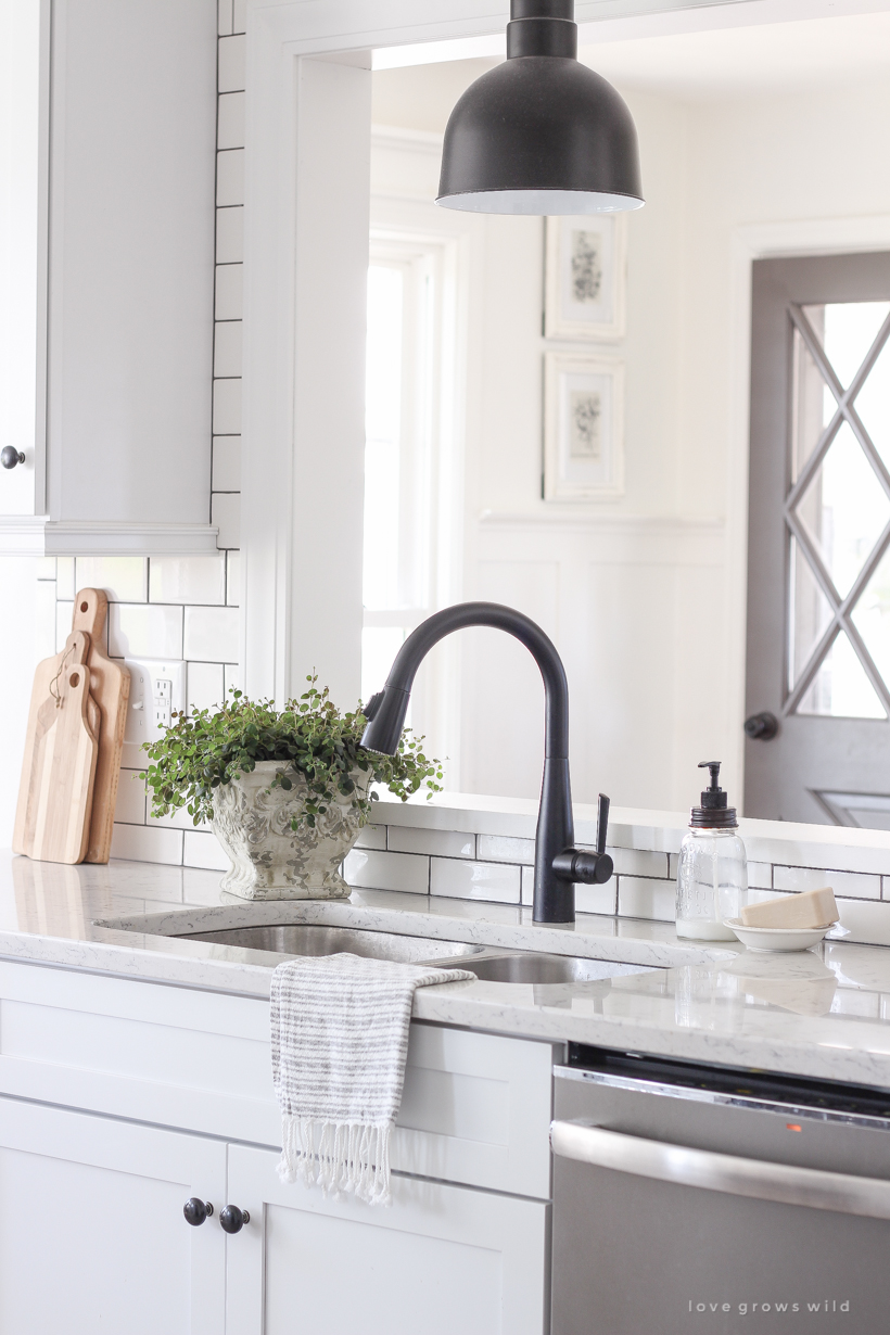 A cozy farmhouse kitchen decorated simply with elements from nature