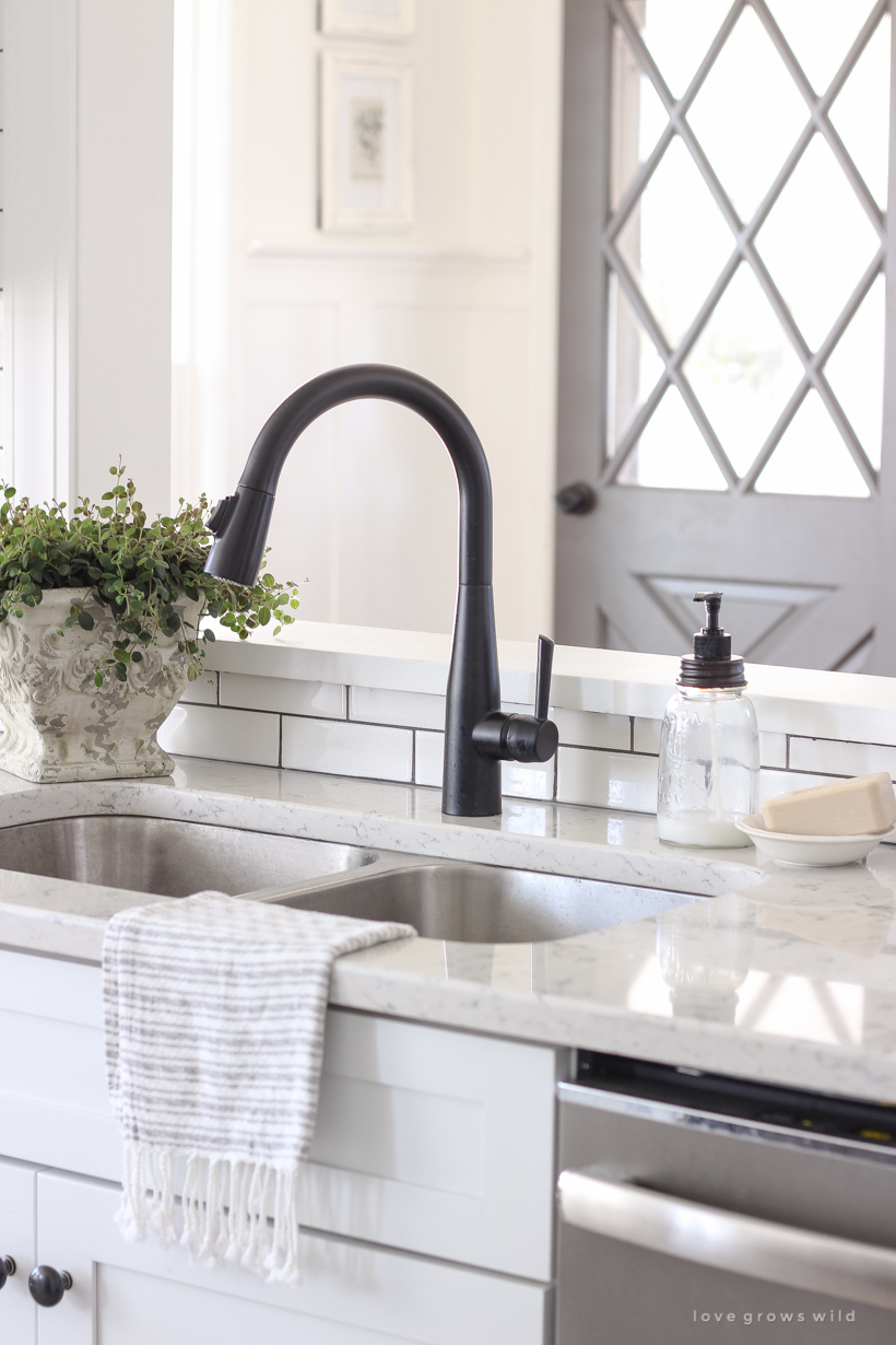 A cozy farmhouse kitchen decorated simply with elements from nature