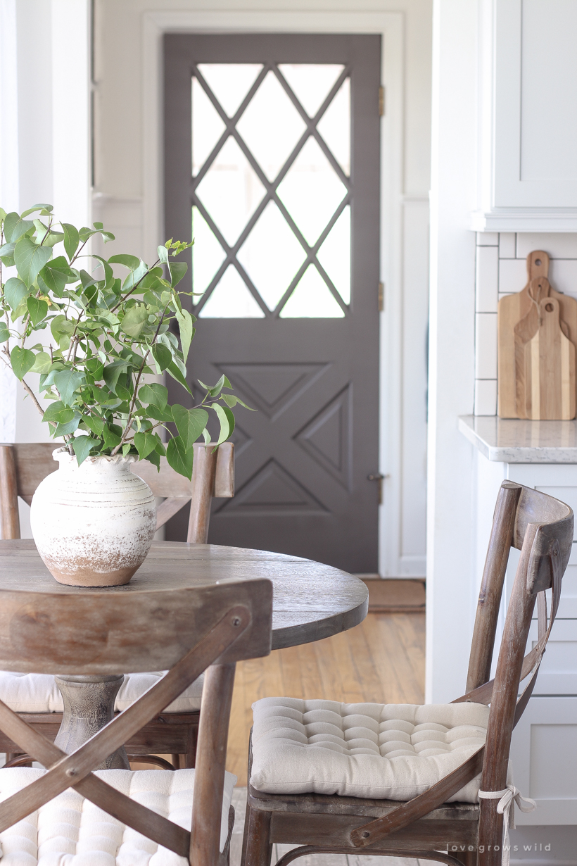 A cozy farmhouse kitchen decorated simply with elements from nature