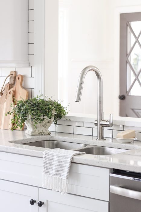 A lovely farmhouse kitchen with a faucet as functional as it is beautiful