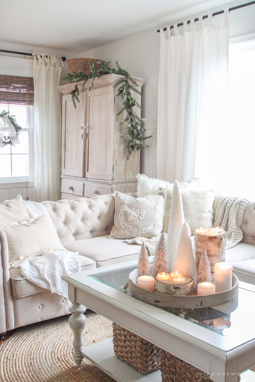 A beautiful neutral, light and bright living room decorated for Christmas