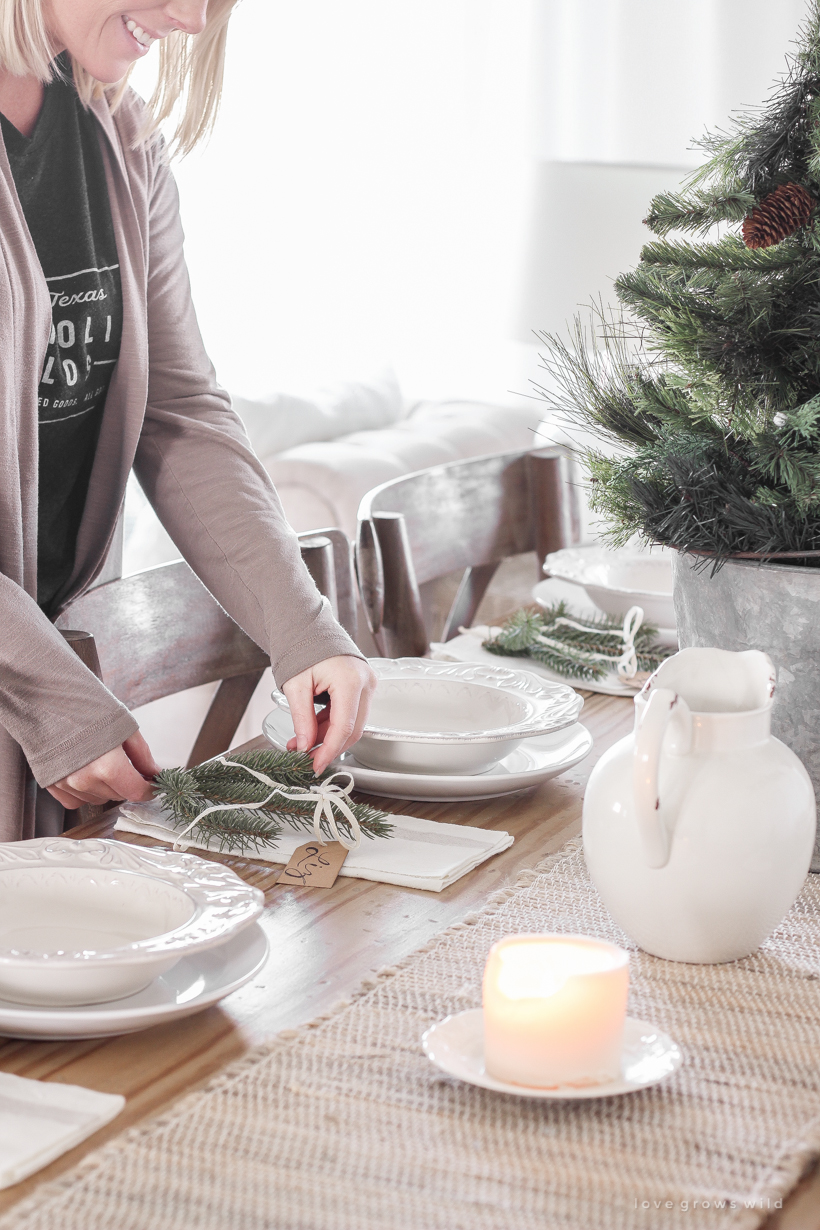 A simple, no fuss Christmas tablescape with fresh greens and beautiful antique metal accents