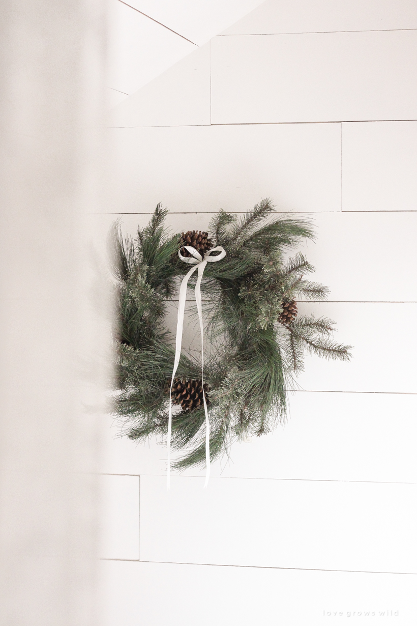 A simple, cozy bedroom decorated for Christmas with a "vintage winter wonderland" theme