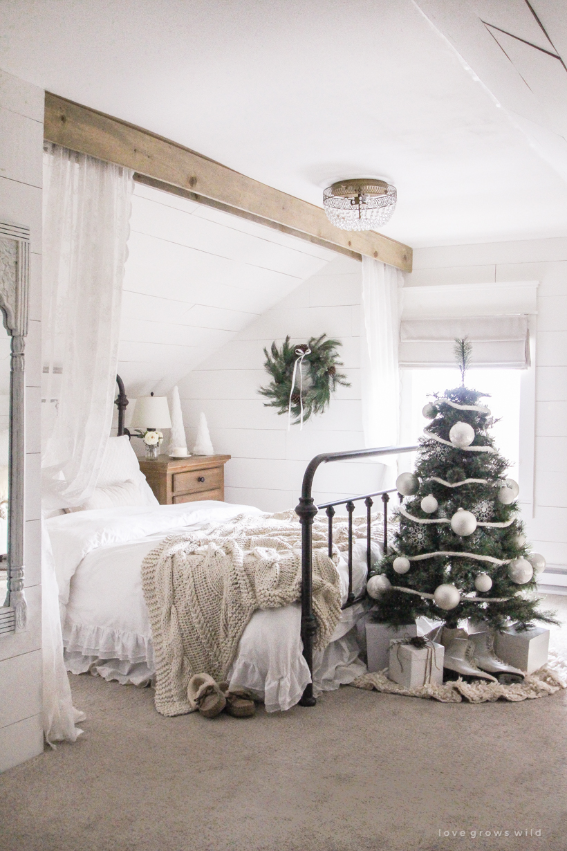 A simple, cozy bedroom decorated for Christmas with a "vintage winter wonderland" theme