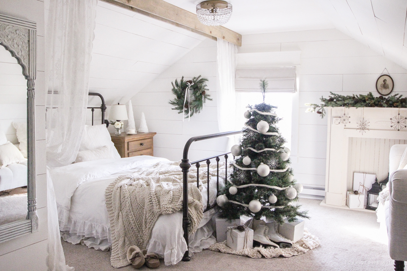 A simple, cozy bedroom decorated for Christmas with a "vintage winter wonderland" theme