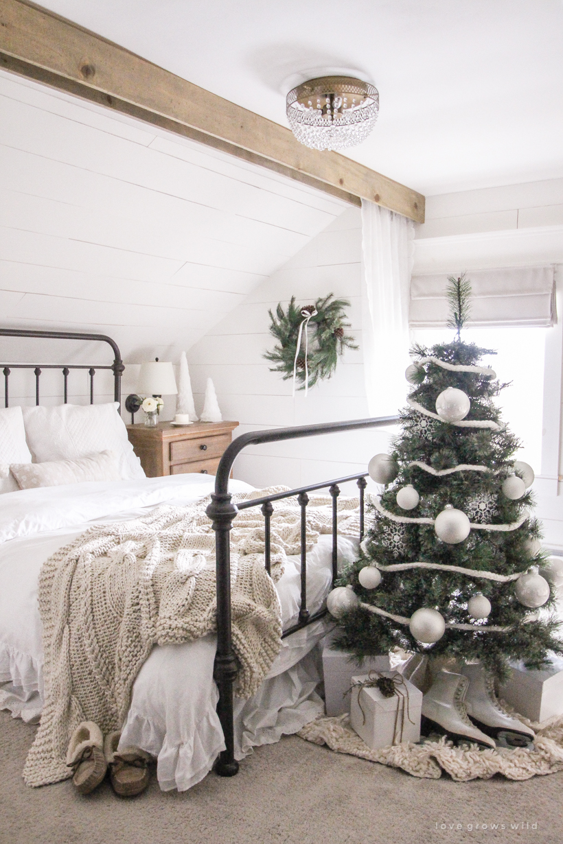 A simple, cozy bedroom decorated for Christmas with a "vintage winter wonderland" theme