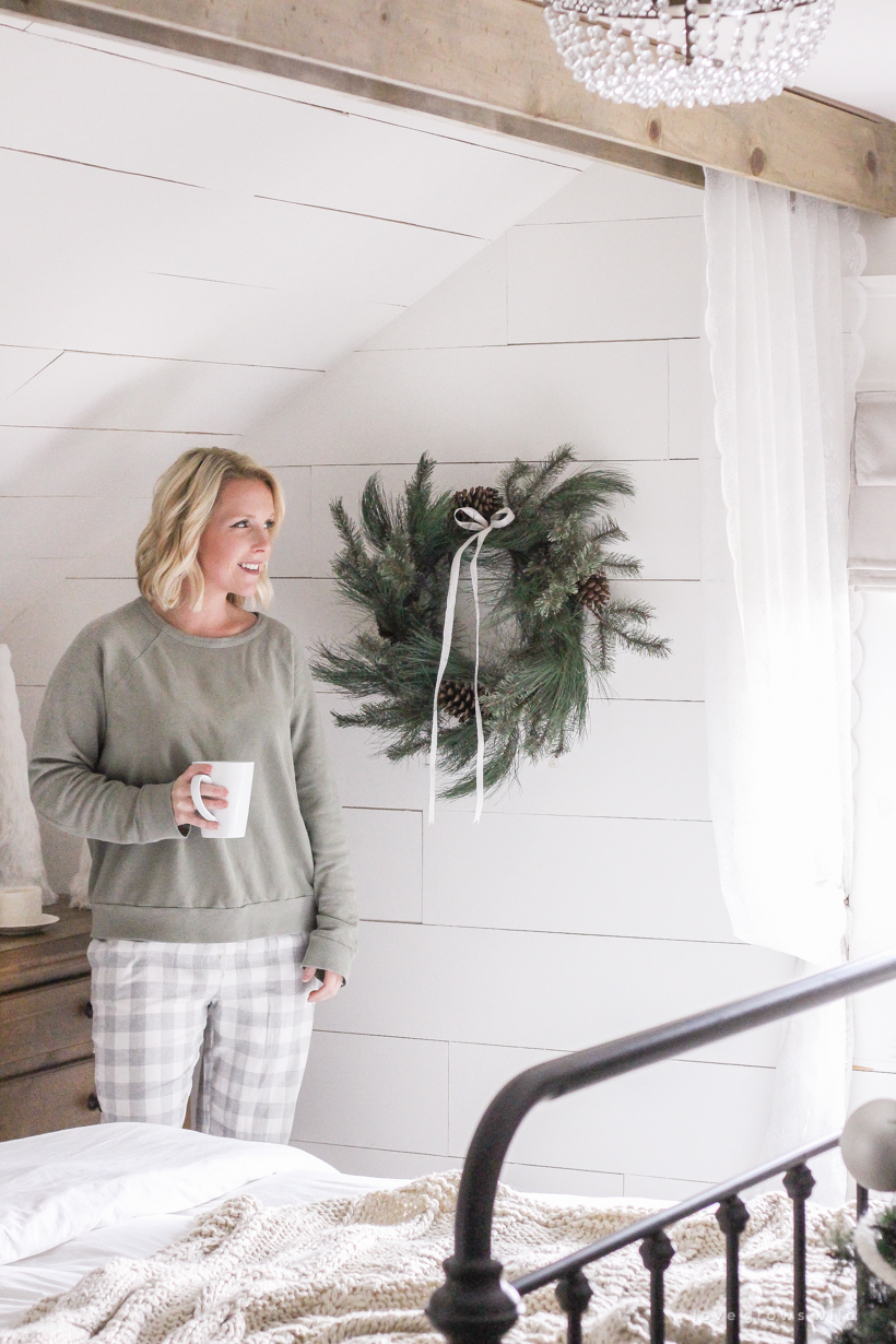 A simple, cozy bedroom decorated for Christmas with a "vintage winter wonderland" theme