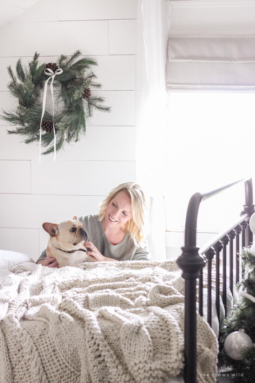 A simple, cozy bedroom decorated for Christmas with a "vintage winter wonderland" theme