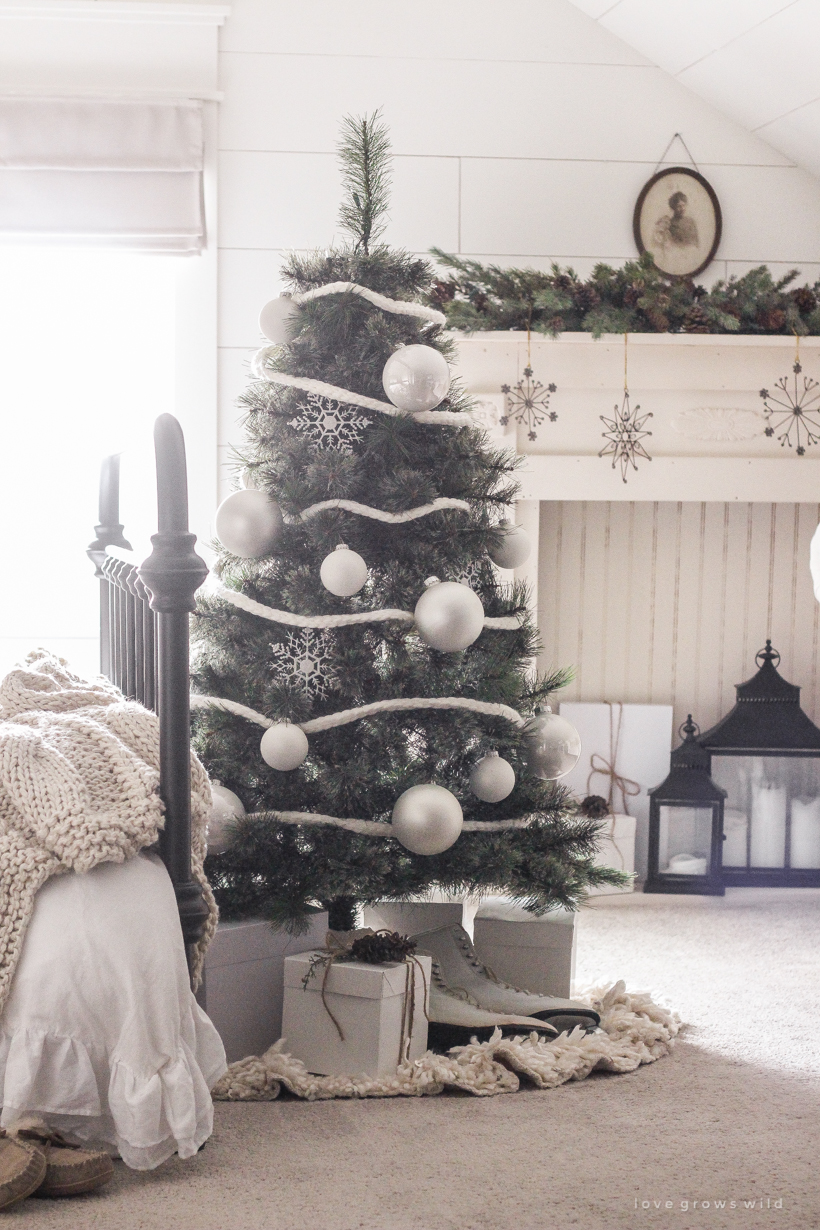 A simple, cozy bedroom decorated for Christmas with a "vintage winter wonderland" theme