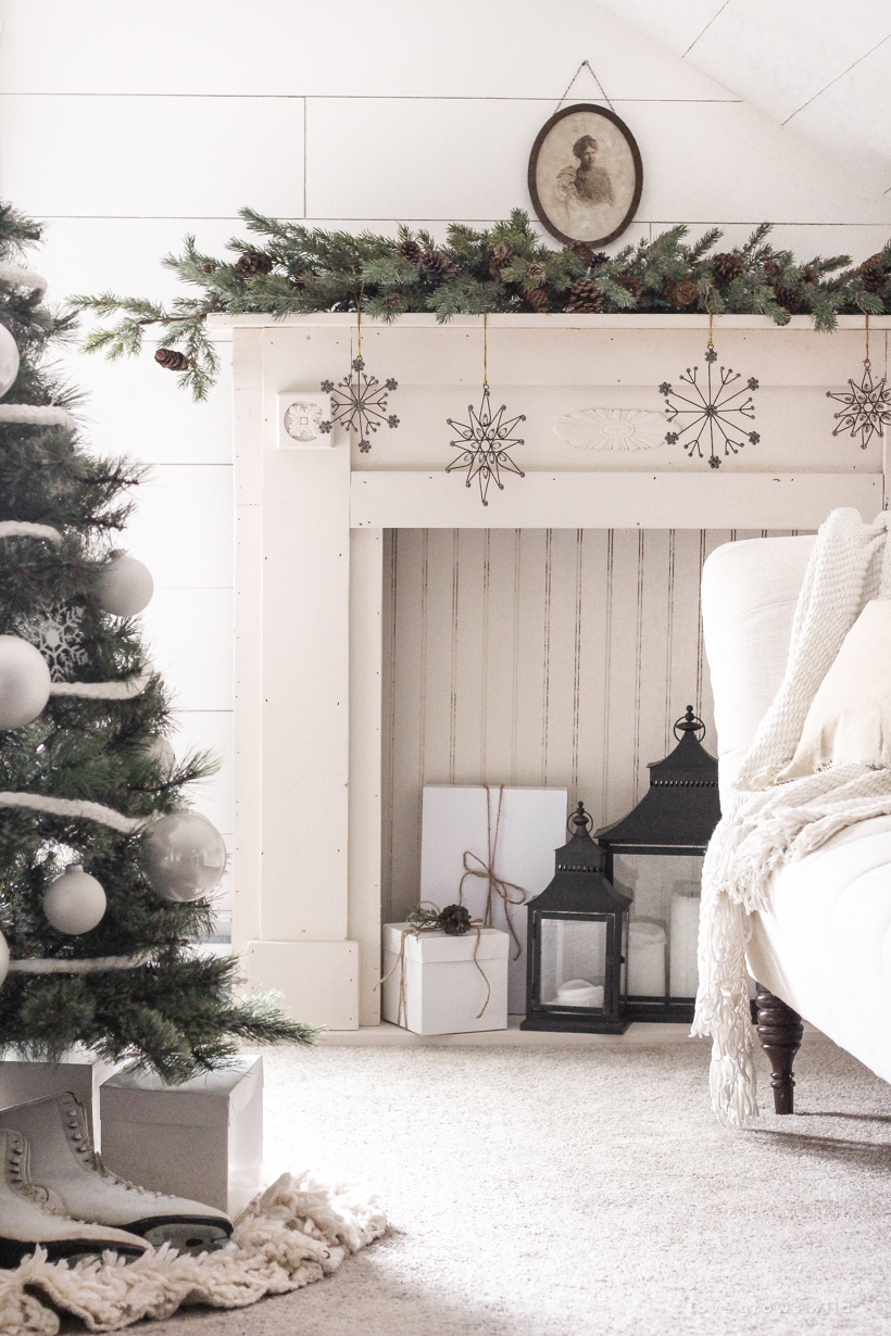 A simple, cozy bedroom decorated for Christmas with a "vintage winter wonderland" theme