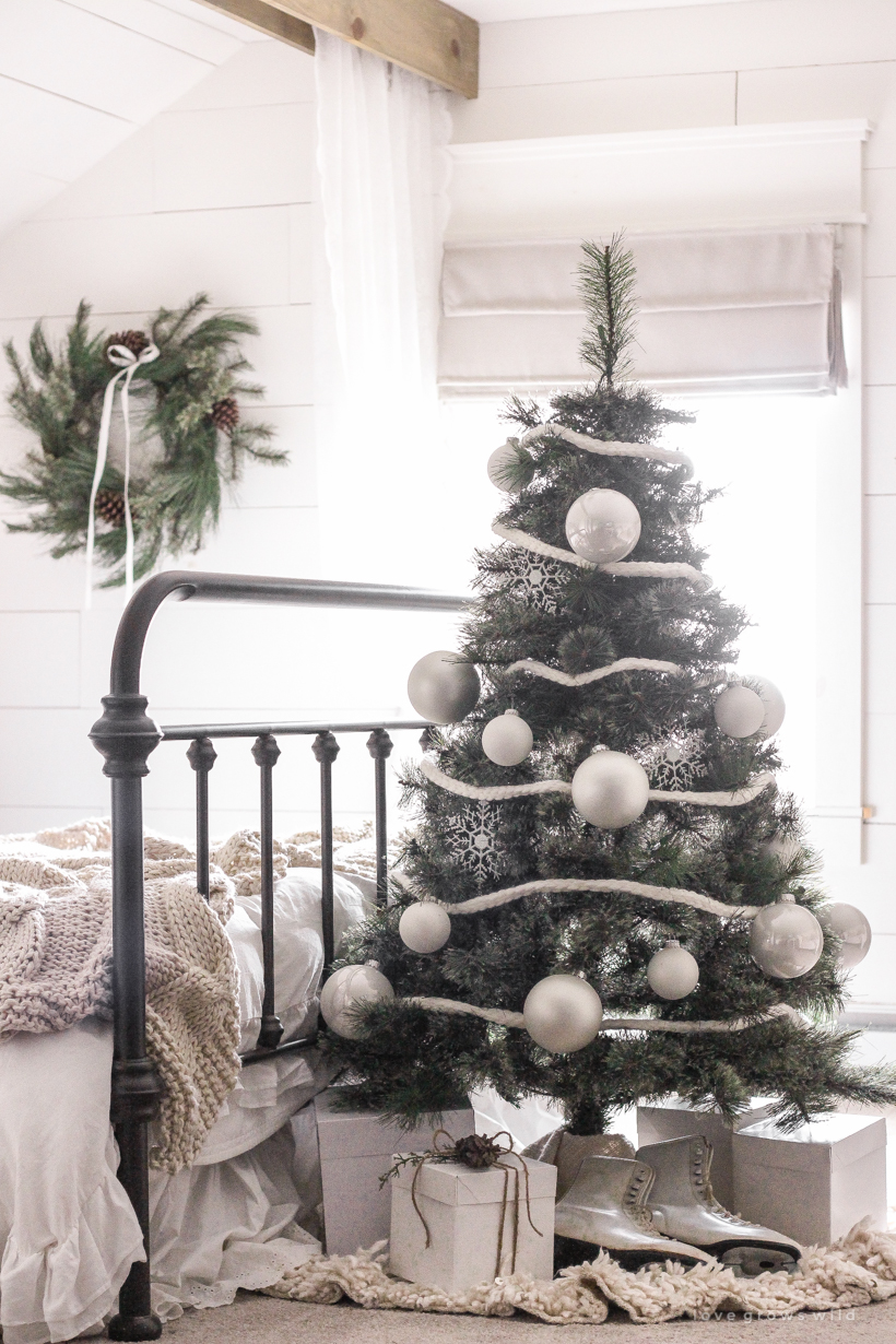 A simple, cozy bedroom decorated for Christmas with a "vintage winter wonderland" theme