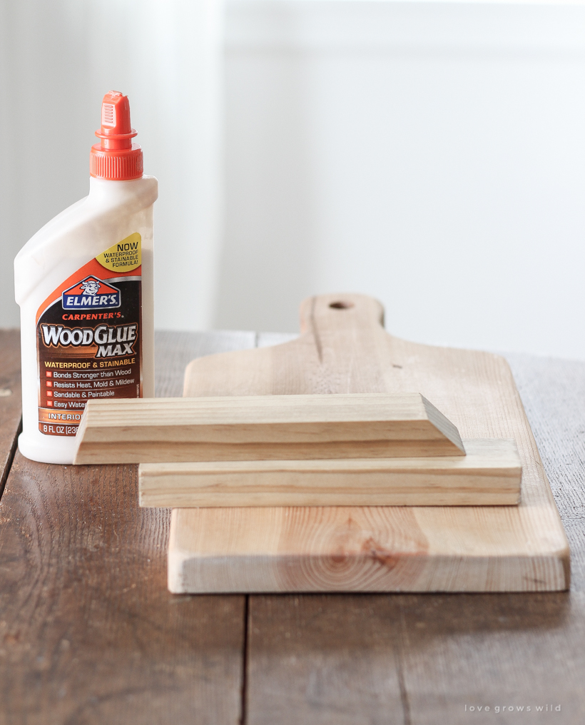 Learn how to make this simple Cutting Board Tablet Holder for your kitchen or an inexpensive handmade gift!