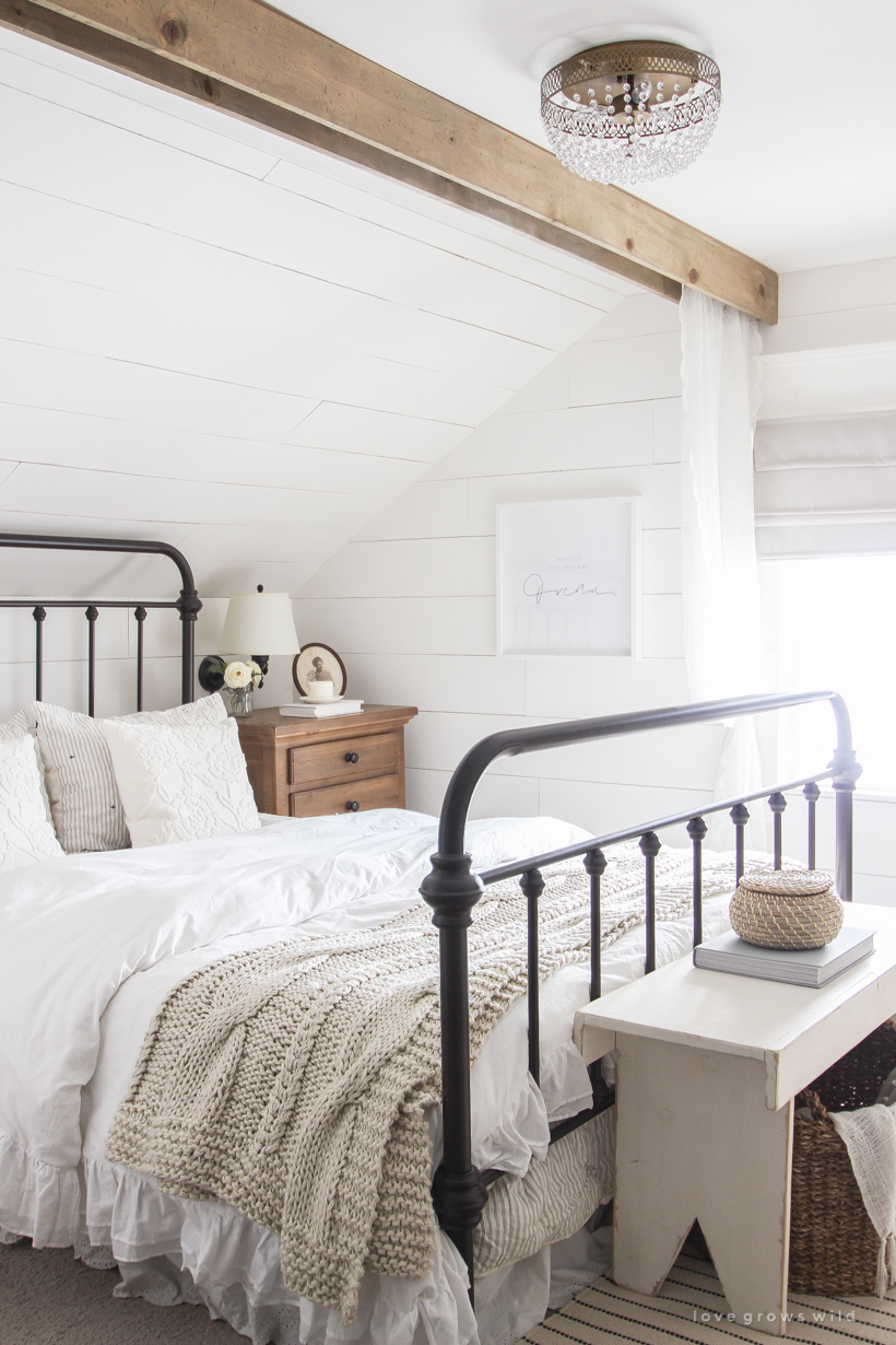 Step inside home and lifestyle blogger Liz Fourez's charming master bedroom with gorgeous farmhouse details and neutral color palette. 