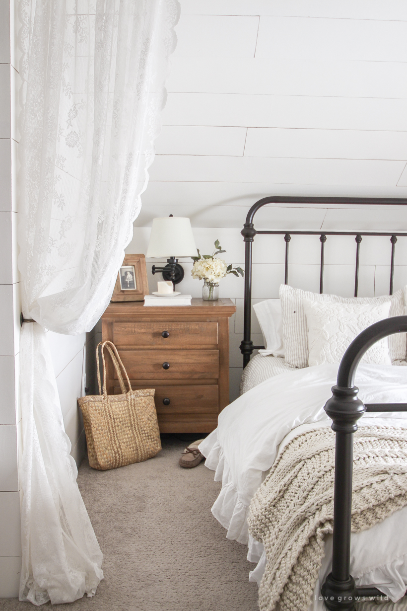 Step inside home and lifestyle blogger Liz Fourez's charming master bedroom with gorgeous farmhouse details and neutral color palette. 