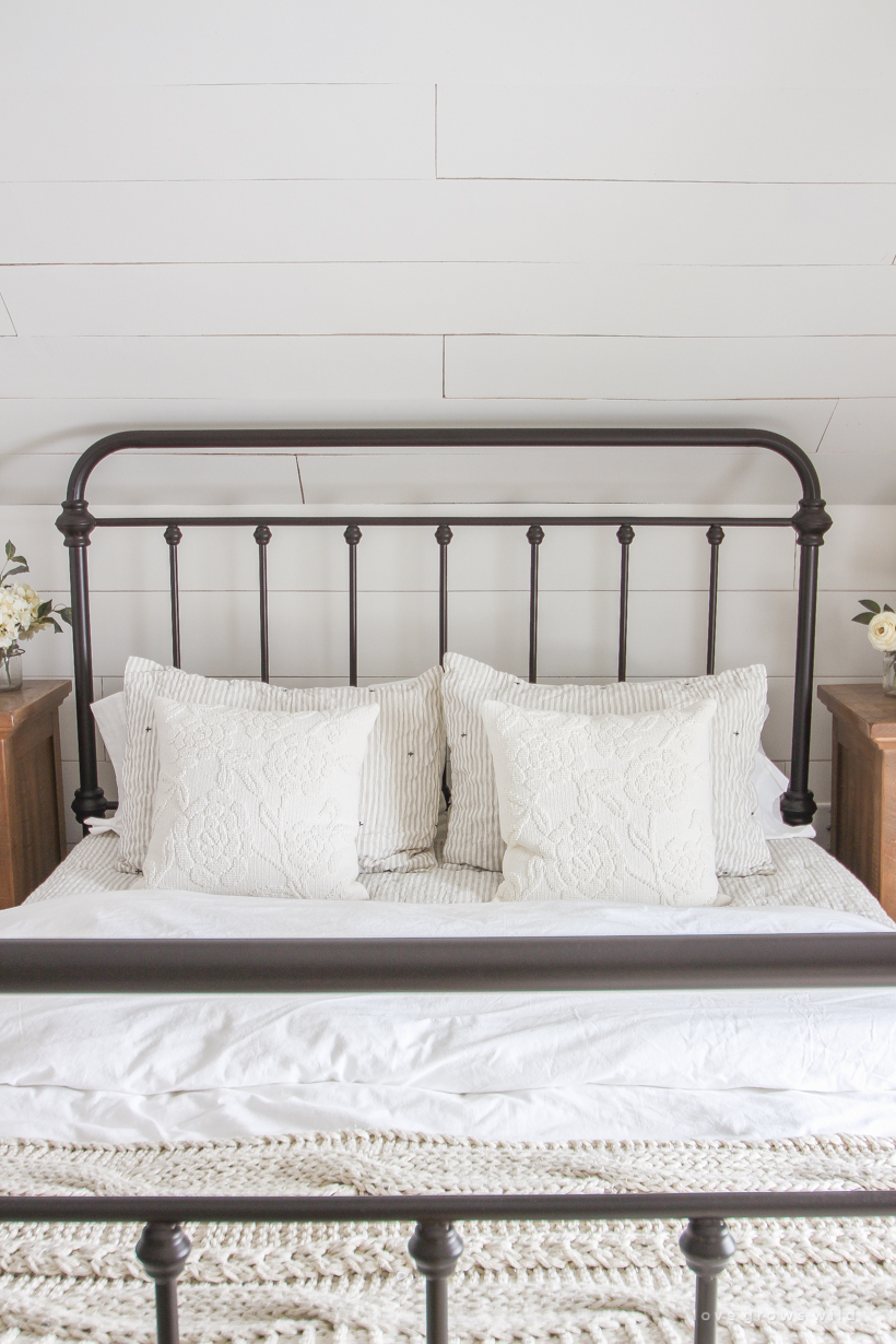 Step inside home and lifestyle blogger Liz Fourez's charming master bedroom with gorgeous farmhouse details and neutral color palette. 