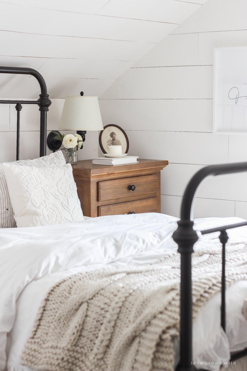 Step inside home and lifestyle blogger Liz Fourez's charming master bedroom with gorgeous farmhouse details and neutral color palette. 