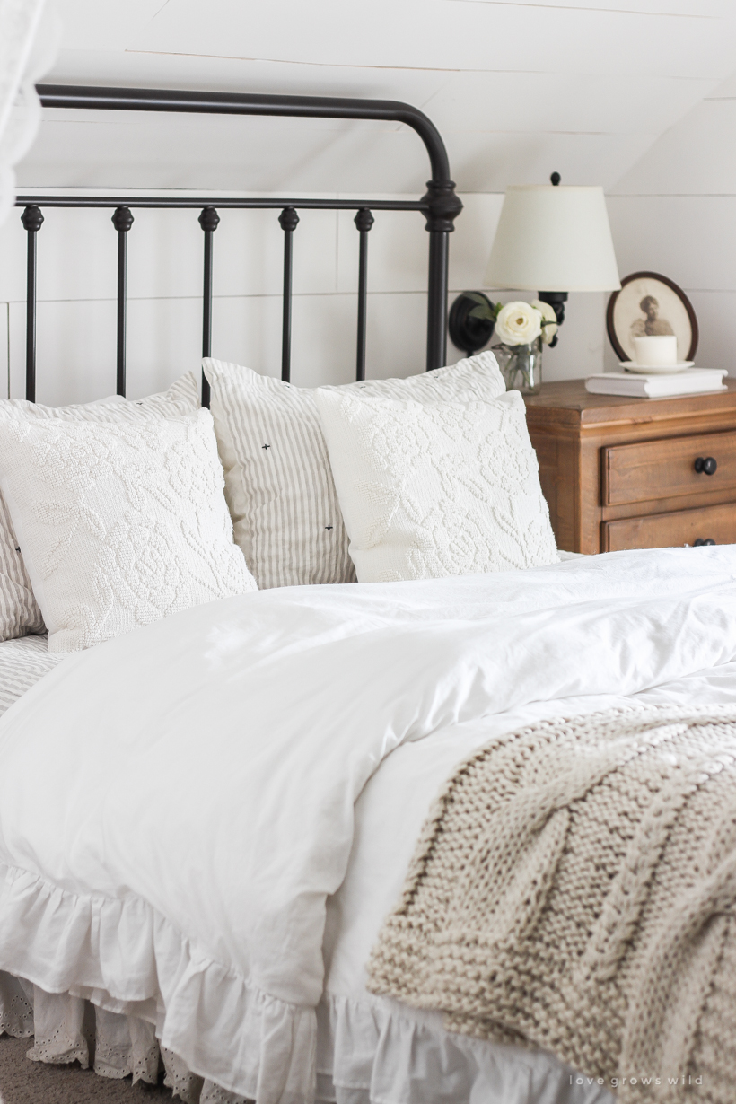 Step inside home and lifestyle blogger Liz Fourez's charming master bedroom with gorgeous farmhouse details and neutral color palette. 