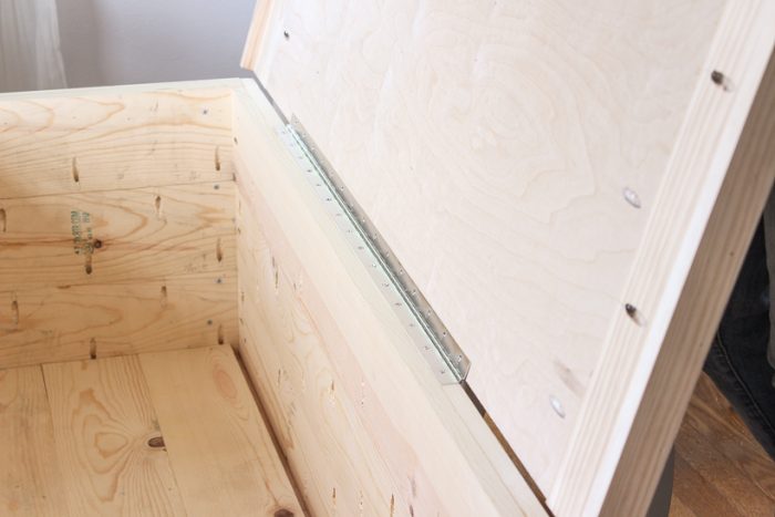 DIY plans and tutorial for a beautiful wood storage trunk with step-by-step photos