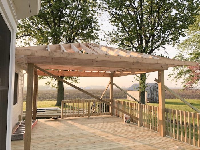 Progression of creating an outdoor living space with a large deck and gazebo