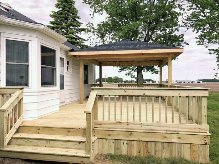 Progression of creating an outdoor living space with a large deck and gazebo