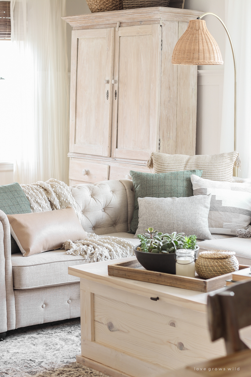 A warm and cozy living room with lots of layers, texture and pattern for fall