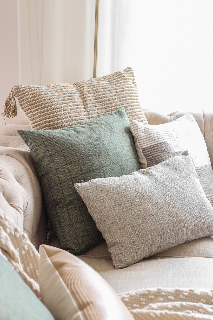 A warm and cozy living room with lots of layers, texture and pattern for fall