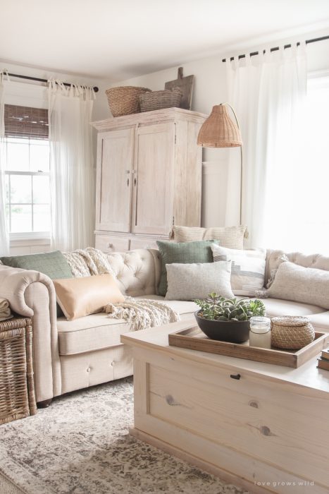 A warm and cozy living room with lots of layers, texture and pattern for fall