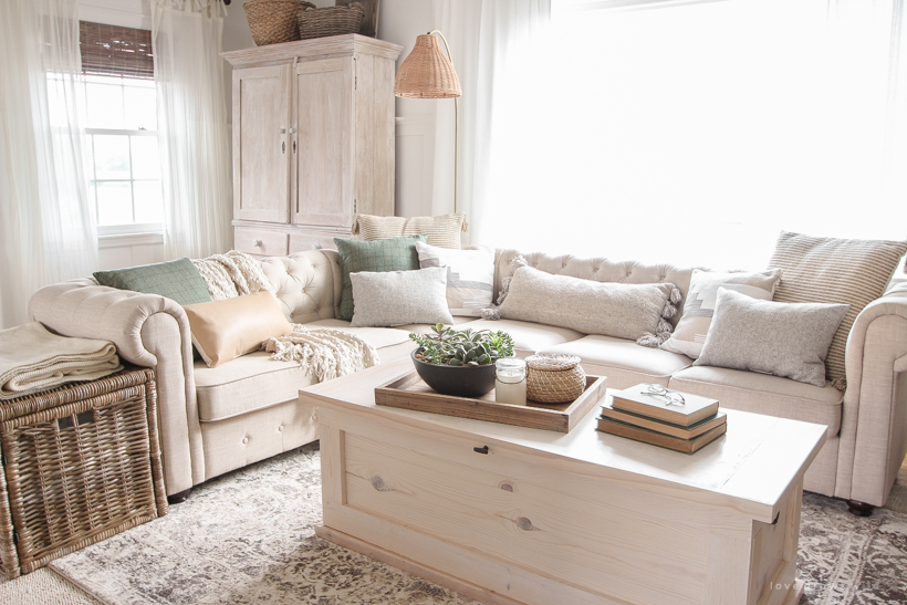 A warm and cozy living room with lots of layers, texture and pattern for fall