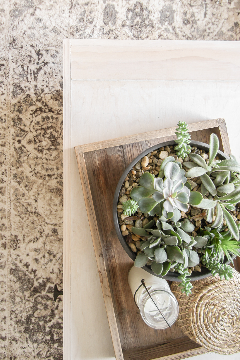 A warm and cozy living room with lots of layers, texture and pattern for fall