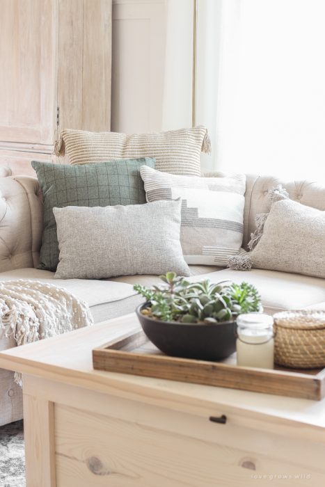 A warm and cozy living room with lots of layers, texture and pattern for fall