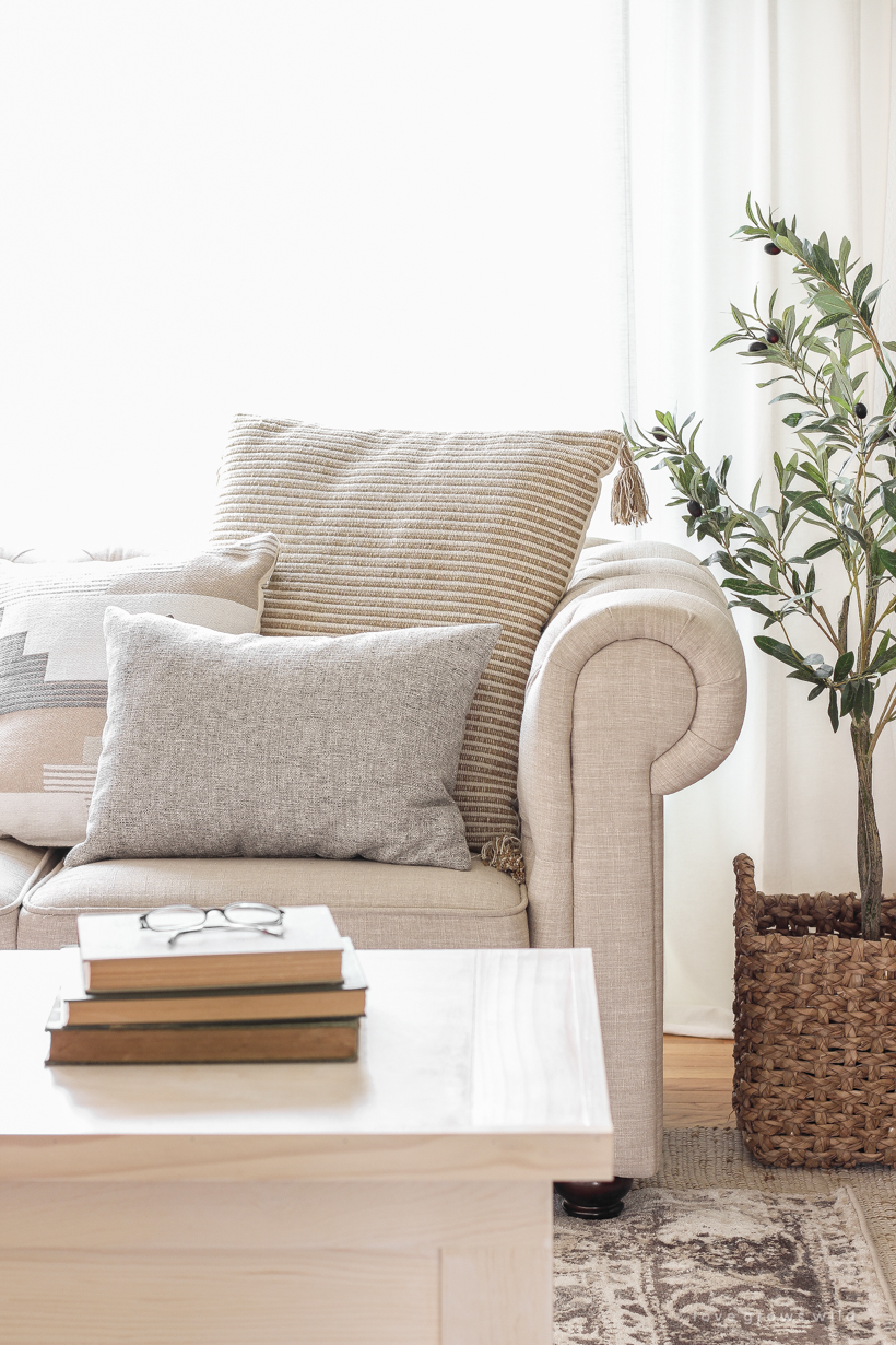 A warm and cozy living room with lots of layers, texture and pattern for fall