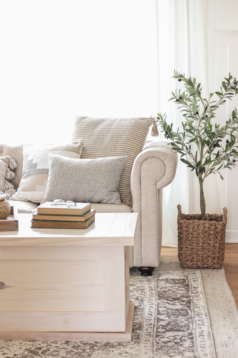 A warm and cozy living room with lots of layers, texture and pattern for fall